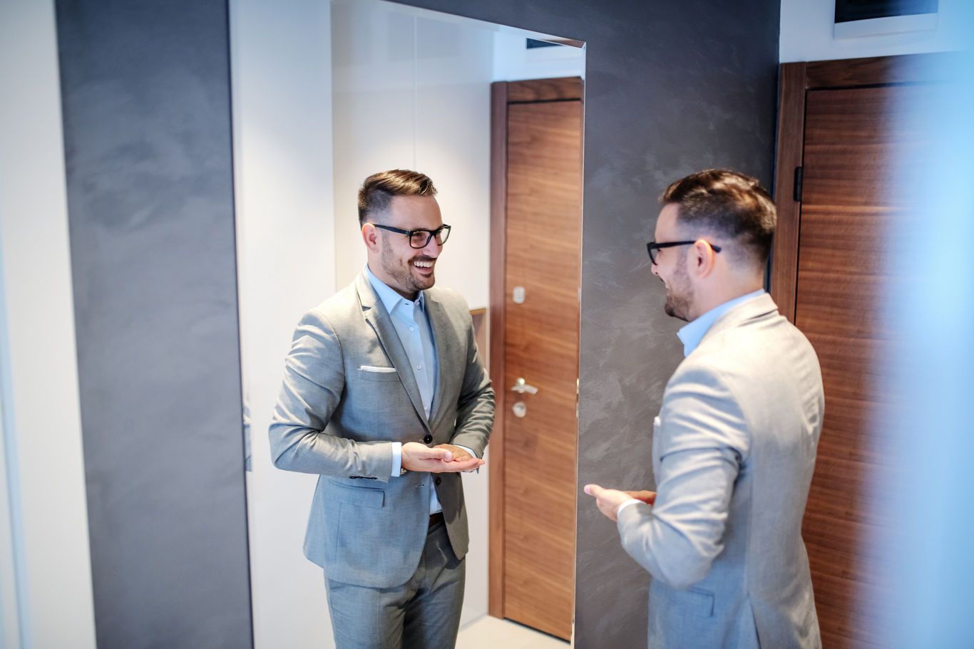 Man in Suit Looking in Mirror | Blog | Greystar